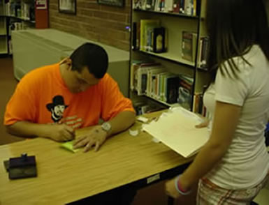 Student Getting Their Pass Signed and I Voted Sticker